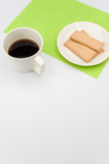 Sticker - cup of black coffee and light crisp cookies in a white plate