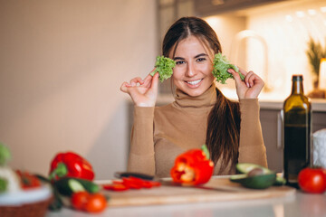 Woman cooking at kitchen