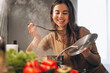 © Petro - Woman cooking soup at kitchen