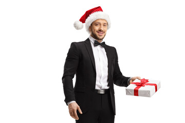 Sticker - Elegant man wearing a santa claus hat and holding a gift box