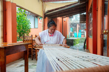 Mexican Woman Weaving On Traditional Loom