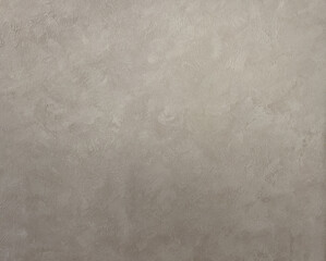 Gray, abstract background with scuffs. Plastered wall with gray texture.
