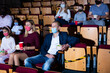 © JackF - Family with child wearing protective masks eating popcorn and watching a movie in the cinema