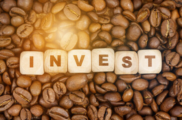 Poster - Among the coffee beans are cubes that say - INVEST