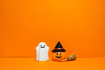 Orange Halloween background with ghosts and pumpkins