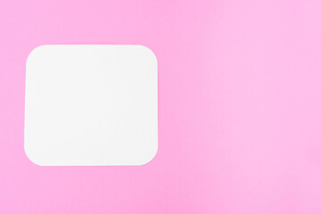 blank piece of paper on a pink background, place for text. Blank card