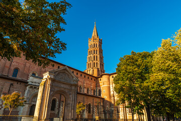 Wall Mural - Bell tower of the Saint Sernin basilica in Toulouse in autumn, Occitanie, France