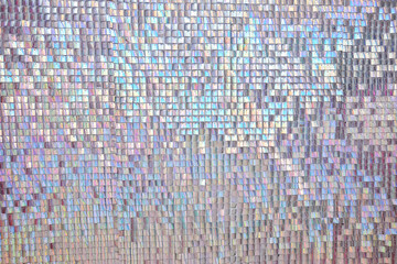 Abstract texture of pearl-colored sequins.