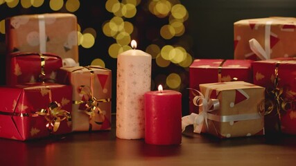 Wall Mural - Christmas candle light burning against blurred background