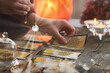 © Monika Wisniewska - Hand with pendulum over tarot cards