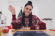 © deagreez - Portrait of attractive cheerful girl using laptop calling on web waving hi hello congrats greetings at decorated home indoors