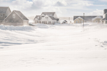 Wall Mural - Unplowed roads after a blizzard in a North American suburban neighborhood.
