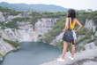 © wing-wing - Alone woman standing on blur view landscape  Mountain and River at Grand Canyon Chonburi Thailand. tourism travel summer holiday in nature, being alone, decisiveness, strong and broken heart concept.
