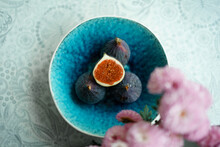 Several Ripe Purple Figs In A Beautiful Blue Plate Stand On The Table. Diet Food. Local Delicacy. Useful Sweets