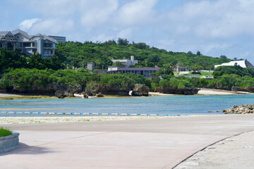 Poster - Building and hill near the sea in Okinawa.