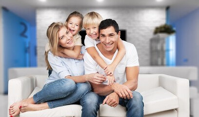 Wall Mural - Cheerful happy young Family having Fun Together At Home