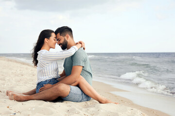 Wall Mural - Lovely couple spending time together on beach