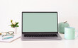 © luciano - Laptop computer with blank green screen on white background. Copy space. Business, study, remote working, nobody