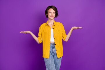 Wall Mural - Portrait of attractive cheerful girl holding on palms copy empty space options ad isolated over bright violet purple color background