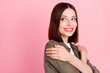 © deagreez - Profile photo of cute bob hairdo young lady hug herself look empty space wear green shirt isolated on pink color background