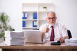 © Elnur - Old male employee and too much work in the office
