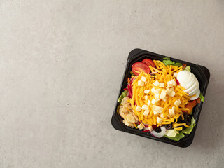 Wall Mural - Cheese Vegetable Salad in Takeaway Container