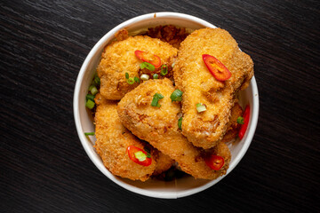 Canvas Print - Portion of fried chicken nuggets with fresh vegetables