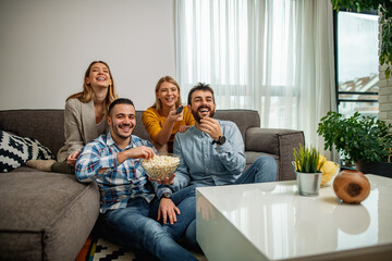 Group of friends watching sport together