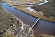© Cameron Davidson/Westend61 - USA, Marsh on the eastern shore of Maryland with a walking path and pedestrian bridge, sea level rise due to global warming