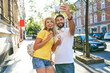 © Bartek Szewczyk/Westend61 - Happy young couple taking a selfie while eating ice cream in the city
