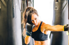 Female Boxer Training In Gym