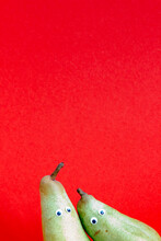 Pair Of Pears In Front Of Red Background