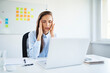 © Bartek Szewczyk/Westend61 - Young businesswoman sitting in office suffering from headache