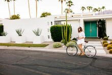 USA, California, Palm Springs, Woman On Bicycle On The Street