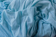 abstract background of old light blue knit fabric texture close up