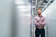 © Daniel Ingold/Westend61 - Portrait of a confident businessman in a modern factory