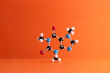 Caffeine Formula's Molecular Structure Over Orange Background