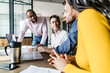 © Giorgio Fochesato/Westend61 - Confident business team having a meeting in loft office