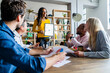 © Giorgio Fochesato/Westend61 - Smiling businesswoman leading a presentation in loft office