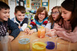 © Westend61 - Group of children in a science chemistry lesson