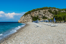 Greece, North Aegean, Rows Of Beach Umbrellas And Empty Deck Chairs On Tsambou Beach In Summer