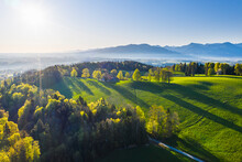 Germany, Bavaria, Buchberg, Drone View Of Green Countryside Landscape At Foggy Springtime Sunrise