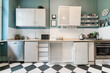 © A. Tamboly/Westend61 - Tidy apartment kitchen withÔøΩcheckerboard floor