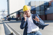 © UWE_UMSTAETTER/Westend61 - Portrait of businessman on the phone at industrial site