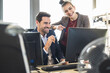 © Uwe Umst√§tter/Westend61 - Business people using computer while working together at office