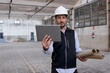 © Veam/Westend61 - Male engineer using digital tablet while working in building at construction site