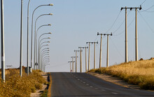 Road With Lights And Power Pylons, Jordan
