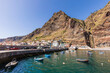 © Werner Dieterich/Westend61 - Portugal, Madeira Island, Paul do Mar, Fishing boats moored in harbor, mountain and town in background