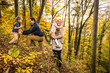 © Wilfried Feder/Westend61 - Parents enjoying with children in forest during autumn