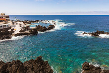 Portugal, Porto Moniz, Small Rocky Bay Along Shore Of Madeira Island With Clear Line Of Horizon OverÔøΩAtlentic Ocean In Background